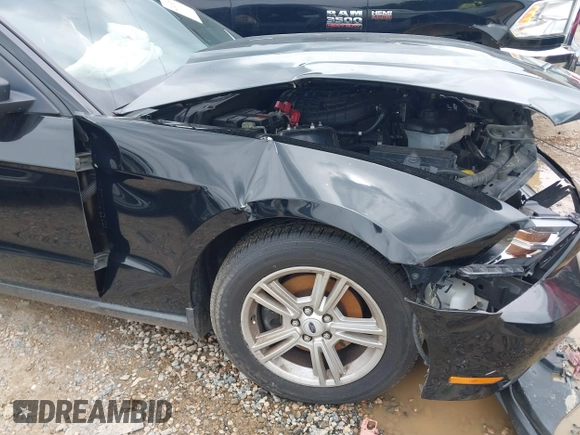 2012 Ford Mustang Premium with VIN 1ZVBP8AM4C5285696, listed as a IAAI auction lot 42465296 with 143,387 mi miles and . Bid and sale history available at DreamBid. Image 22.
