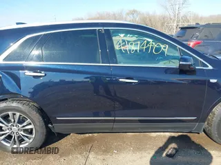 2021 Cadillac XT5 FWD Premium Luxury z VIN 1GYKNCRS2MZ141440, wystawiony jako IAAI lot #41874409 z przebiegiem 76 911 mil mil oraz . Historia ofert i sprzedaży dostępna na DreamBid. Obrazek 13.