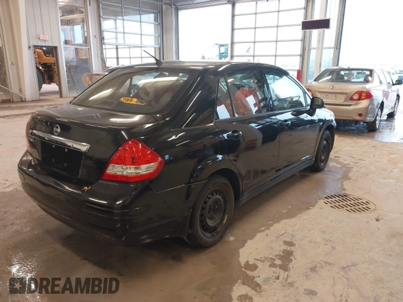 2009 Nissan Versa 1.8 S with VIN 3N1BC11E99L438342, listed as a IAAI auction lot 41561812 with 152,141 mi miles. Bid and sale history available at carsss.com. Image 4.