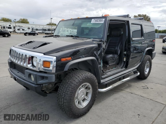 2005 Hummer H2 SUV with VIN 5GRGN23UX5H115383, listed as a Copart auction lot 71682984 with 157,405 mi miles and Salvage Title. Bid and sale history available at carsss.com. Image 1.