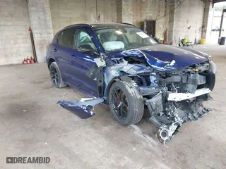 2021 Alfa Romeo Stelvio Ti with VIN ZASPAKBN4M7D21284, listed as a IAAI auction lot 40573443 with 26,230 mi miles. Bid and sale history available at carsss.com. Image 1.