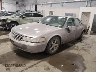 1998 Cadillac Seville STS z VIN 1G6KY5490WU916771, wystawiony jako Copart lot #58699555 z przebiegiem 129 944 mil mil oraz Nie do naprawy. Historia ofert i sprzedaży dostępna na DreamBid. Obrazek 1.
