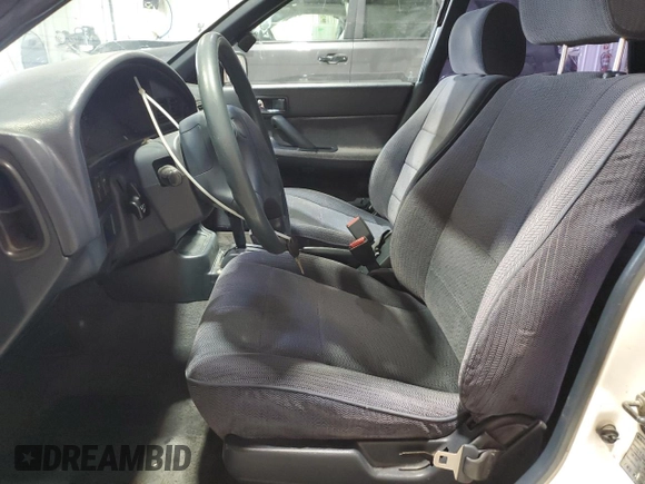 1994 Subaru Legacy L with VIN 4S3BJ6335R9948773, listed as a Copart auction lot 77018384 with 189,202 mi miles and Clean title. Bid and sale history available at DreamBid. Image 7.