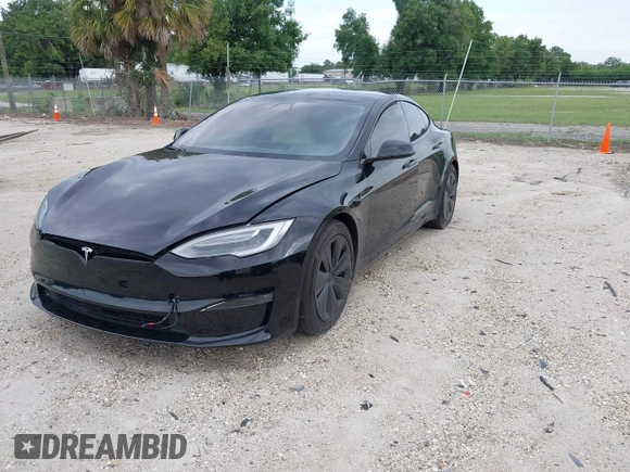 2022 Tesla Model S with VIN 5YJSA1E51NF472152, listed as a IAAI auction lot 42625943 with 60,290 mi miles and . Bid and sale history available at DreamBid. Image 18.