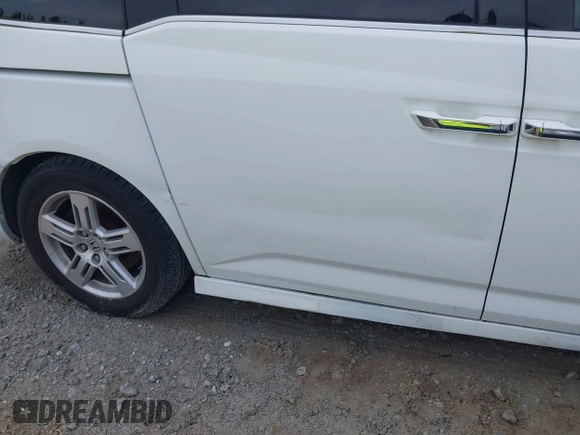 2011 Honda Odyssey Touring with VIN 5FNRL5H90BB066177, listed as a IAAI auction lot 42053368 with 239,205 mi miles and . Bid and sale history available at DreamBid. Image 6.