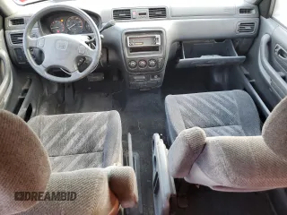 1999 Honda CR-V LX with VIN JHLRD2848XC011581, listed as a Copart auction lot 77183294 with 218,474 mi miles and Salvage Title. Bid and sale history available at carsss.com. Image 8.