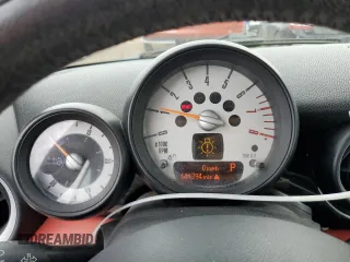 2012 MINI Convertible with VIN WMWZN3C58CT134224, listed as a Copart auction lot 57610015 with 141,394 mi miles and Salvage title. Bid and sale history available at DreamBid. Image 9.