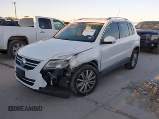 2010 Volkswagen Tiguan SEL with VIN WVGBV7AX4AW514362, listed as a IAAI auction lot 41413300 with 154,201 mi miles and . Bid and sale history available at DreamBid. Image 2.