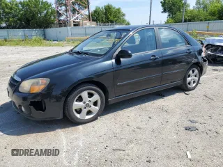 2009 Kia Spectra EX with VIN KNAFE221295027047, listed as a Copart auction lot 64205085 with 245,508 mi miles and Salvage title. Bid and sale history available at DreamBid. Image 1.