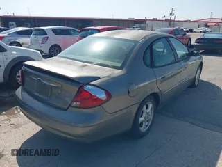 2003 Ford Taurus SE Standard z VIN 1FAFP53UX3A228383, wystawiony jako IAAI lot #42700752 z przebiegiem 182 598 mil mil oraz . Historia ofert i sprzedaży dostępna na DreamBid. Obrazek 6.