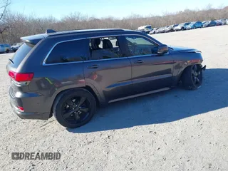 2015 Jeep Grand Cherokee Overland with VIN 1C4RJFCGXFC215750, listed as a IAAI auction lot 40795135 with 89,110 mi miles and . Bid and sale history available at DreamBid. Image 4.