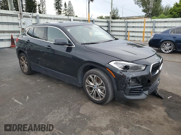 2018 BMW X2 sDrive28i with VIN WBXYJ3C34JEJ91176, listed as a Copart auction lot 63418365 with 62,586 mi miles and Salvage title. Bid and sale history available at DreamBid. Image 4.