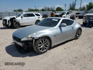 2014 Nissan 370Z Touring z VIN JN1AZ4EH2EM631819, wystawiony jako Copart lot #52592595 z przebiegiem 114 962 mil mil oraz Szkoda całkowita • Salvage title. Historia ofert i sprzedaży dostępna na DreamBid. Obrazek 1.
