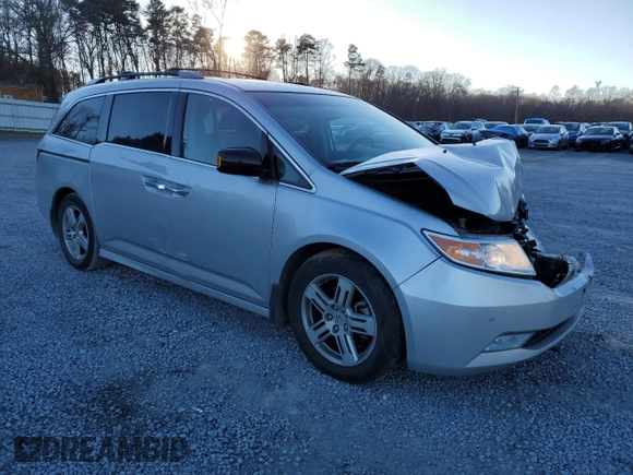 2012 Honda Odyssey Touring with VIN 5FNRL5H9XCB027758, listed as a Copart auction lot 86058504 with 164,860 mi miles and Salvage Title. Bid and sale history available at DreamBid. Image 4.