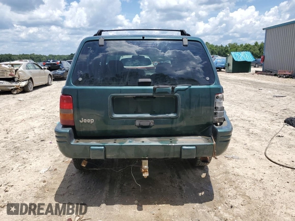1998 Jeep Grand Cherokee Laredo with VIN 1J4GZ48S5WC289251, listed as a Copart auction lot 63594685 with 156,358 mi miles and Salvage title. Bid and sale history available at DreamBid. Image 6.
