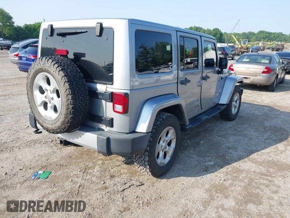 2015 Jeep Wrangler Unlimited Sahara with VIN 1C4BJWEG9FL570780, listed as a IAAI auction lot 42474940 with 116,226 mi miles and . Bid and sale history available at DreamBid. Image 4.