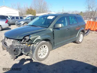 2018 Dodge Journey SXT with VIN 3C4PDCBG6JT335847, listed as a IAAI auction lot 41739617 with 124,204 mi miles. Bid and sale history available at carsss.com. Image 2.
