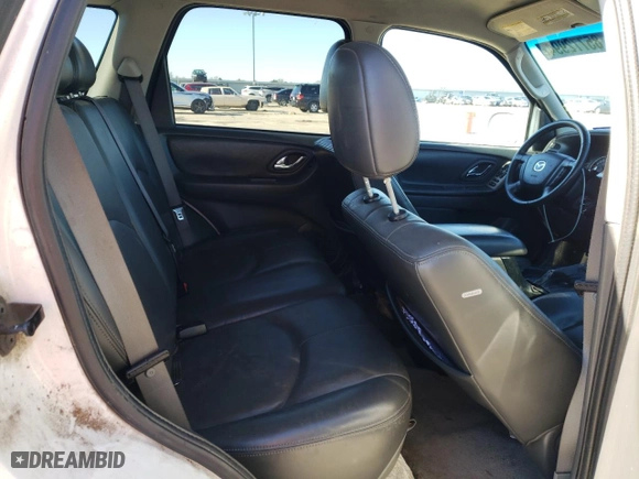 2005 Mazda Tribute s with VIN 4F2CZ06115KM38525, listed as a Copart auction lot 85772994 with 203,704 mi miles and Salvage Title. Bid and sale history available at carsss.com. Image 10.