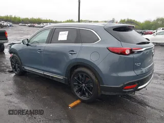 2021 Mazda CX-9 Grand Touring z VIN JM3TCBDY8M0528365, wystawiony jako IAAI lot #42222394 z przebiegiem 44 850 mil mil oraz . Historia ofert i sprzedaży dostępna na DreamBid. Obrazek 3.
