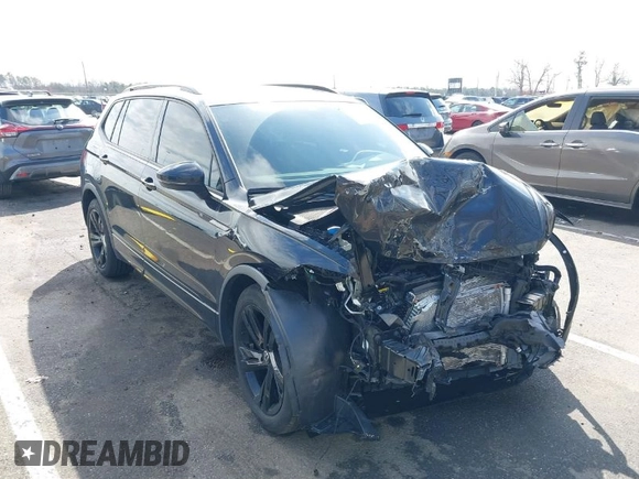2023 Volkswagen Tiguan SE R-Line Black with VIN 3VVCB7AXXPM094621, listed as a IAAI auction lot 41737103 with 21,069 mi miles and . Bid and sale history available at DreamBid. Image 1.