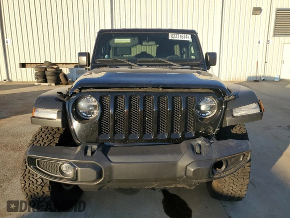 2022 Jeep Wrangler Unlimited High Tide with VIN 1C4HJXDG0NW247152, listed as a Copart auction lot 82371674 with 32,417 mi miles and Salvage Title. Bid and sale history available at DreamBid. Image 5.