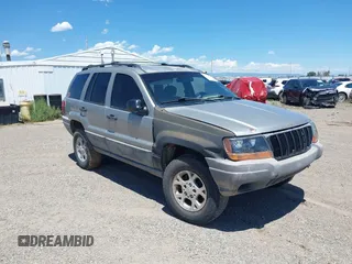 2000 Jeep Grand Cherokee Laredo z VIN 1J4GW48S8YC172274, wystawiony jako IAAI lot #39738087 z przebiegiem 335 809 mil mil oraz . Historia ofert i sprzedaży dostępna na DreamBid. Obrazek 1.