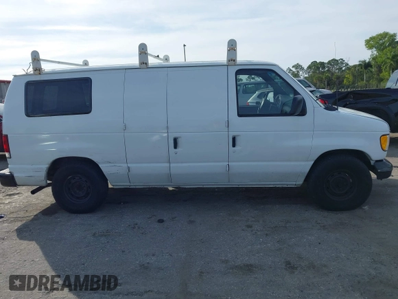 2001 Ford Econoline Cargo with VIN 1FTRE14291HA84414, listed as a IAAI auction lot 41463623 with 192,835 mi miles. Bid and sale history available at carsss.com. Image 14.
