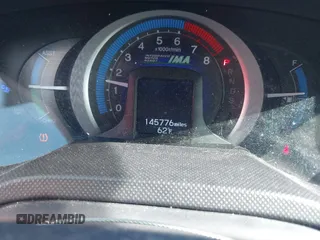 2010 Honda Insight EX with VIN JHMZE2H78AS032088, listed as a IAAI auction lot 41694387 with 145,776 mi miles and . Bid and sale history available at DreamBid. Image 7.