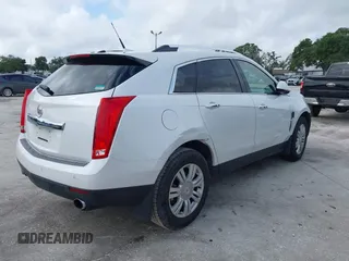 2011 Cadillac SRX Luxury Collection with VIN 3GYFNAEY7BS584662, listed as a IAAI auction lot 40268537 with 157,817 mi miles. Bid and sale history available at carsss.com. Image 4.