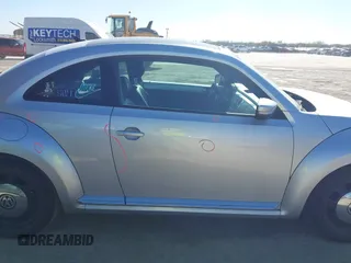 2013 Volkswagen Beetle 2.5L w/Sun/Sound/Nav with VIN 3VWJX7AT3DM663774, listed as a IAAI auction lot 41738146 with 98,064 mi miles and . Bid and sale history available at DreamBid. Image 13.