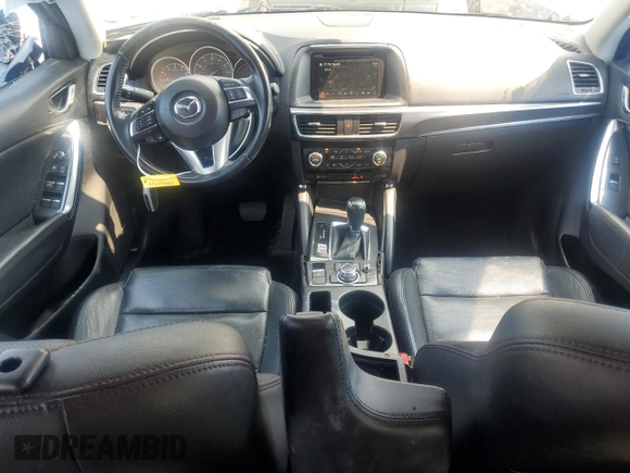 2016 Mazda CX-5 Grand Touring z VIN JM3KE4DY5G0741800, wystawiony jako Copart lot #58565455 z przebiegiem 33 675 mil mil oraz Szkoda całkowita • Salvage title. Historia ofert i sprzedaży dostępna na DreamBid. Obrazek 8.