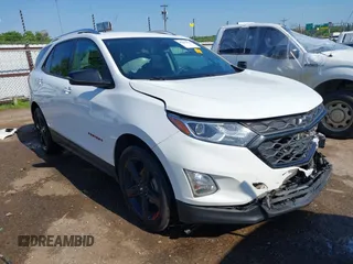 2021 Chevrolet Equinox Premier z VIN 2GNAXNEV9M6120241, wystawiony jako IAAI lot #42222928 z przebiegiem 104 274 mil mil oraz . Historia ofert i sprzedaży dostępna na DreamBid. Obrazek 1.