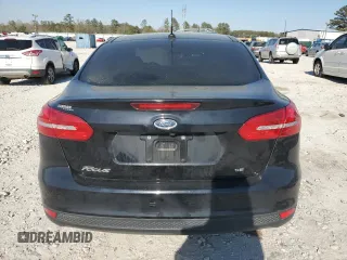 2017 Ford Focus SE with VIN 1FADP3F26HL331253, listed as a Copart auction lot 50869865 with 60,776 mi miles and Salvage title. Bid and sale history available at DreamBid. Image 6.