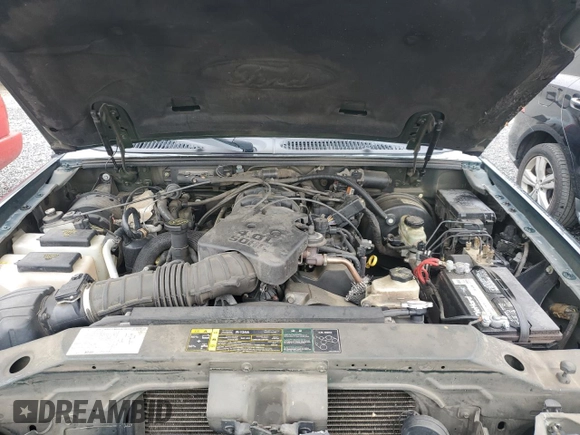 2004 Ford Explorer Sport Trac XLS with VIN 1FMZU67K04UA70503, listed as a Copart auction lot 58214785 with 195,688 mi miles and Salvage title. Bid and sale history available at DreamBid. Image 11.