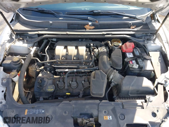 2013 Ford Taurus SEL with VIN 1FAHP2E8XDG191132, listed as a IAAI auction lot 41833542 with 165,125 mi miles. Bid and sale history available at carsss.com. Image 10.