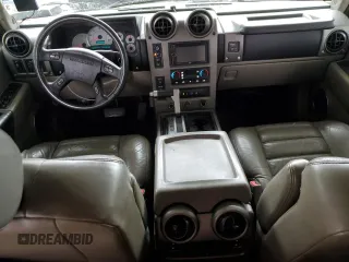 2003 Hummer H2 with VIN 5GRGN23U33H118459, listed as a Copart auction lot 77765694 with 157,390 mi miles and Salvage Title. Bid and sale history available at carsss.com. Image 8.