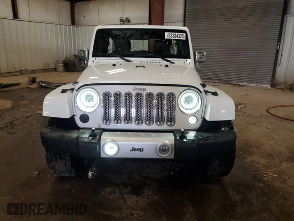 2015 Jeep Wrangler Unlimited Wrangler X with VIN 1C4HJWEG7FL671259, listed as a Copart auction lot 52334325 with 81,244 mi miles and Clean title. Bid and sale history available at DreamBid. Image 5.