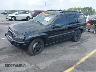 2002 Jeep Grand Cherokee Laredo with VIN 1J4GX48S42C313801, listed as a IAAI auction lot 42297223 with 153,633 mi miles and . Bid and sale history available at DreamBid. Image 2.