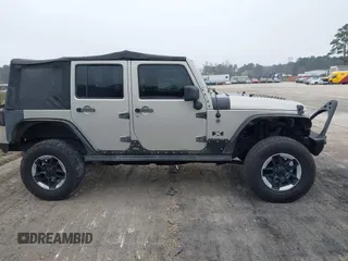 2007 Jeep Wrangler Unlimited X with VIN 1J4GA391X7L107424, listed as a IAAI auction lot 41752013 with 196,557 mi miles and . Bid and sale history available at DreamBid. Image 13.