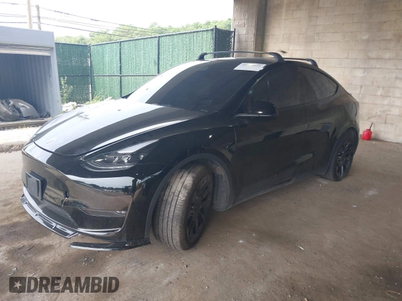 2023 Tesla Model Y Long Range with VIN 7SAYGDEE3PA185778, listed as a IAAI auction lot 39721611 with 11,986 mi miles and . Bid and sale history available at DreamBid. Image 17.