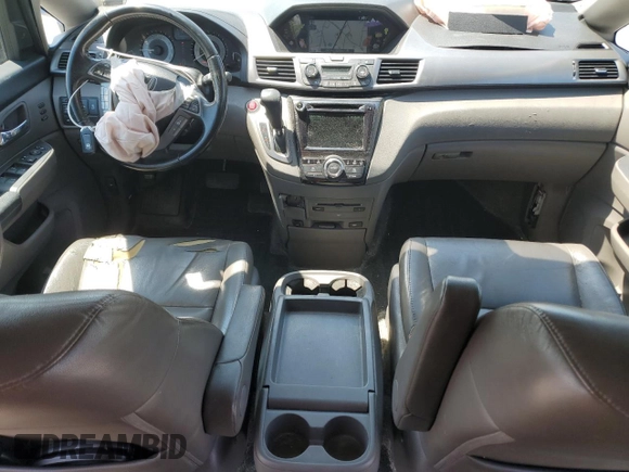 2014 Honda Odyssey Touring with VIN 5FNRL5H93EB061754, listed as a Copart auction lot 55182015 with 168,058 mi miles and Salvage title. Bid and sale history available at DreamBid. Image 8.