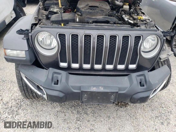 2020 Jeep Wrangler Unlimited Sahara with VIN 1C4HJXENXLW148140, listed as a Copart auction lot 43897435 with 104,411 mi miles and Salvage Title. Bid and sale history available at carsss.com. Image 12.