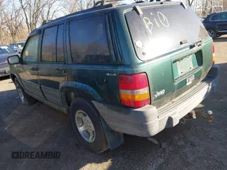 1997 Jeep Grand Cherokee Laredo with VIN 1J4GZ58S2VC605385, listed as a IAAI auction lot 41797715 with 169,996 mi miles and . Bid and sale history available at DreamBid. Image 3.