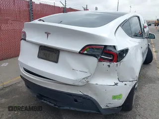 2023 Tesla Model Y Long Range with VIN 7SAYGAEE9PF702910, listed as a IAAI auction lot 42199519 with 91,094 mi miles and . Bid and sale history available at DreamBid. Image 6.