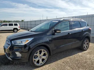 2018 Ford Escape Titanium with VIN 1FMCU9J96JUB12634, listed as a Copart auction lot 63194415 with 95,323 mi miles and Clean title. Bid and sale history available at DreamBid. Image 1.