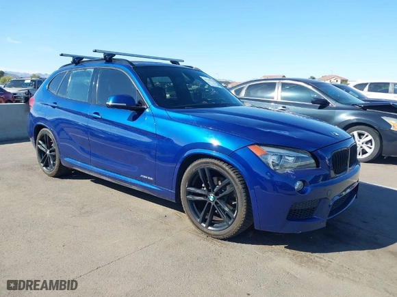 2015 BMW X1 xDrive28i with VIN WBAVL1C56FVY32753, listed as a IAAI auction lot 41759454 with 130,823 mi miles. Bid and sale history available at carsss.com. Image 1.