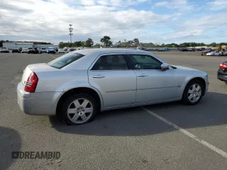 2006 Chrysler 300 C with VIN 2C3KK63H46H296625, listed as a Copart auction lot 70220974 with 104,811 mi miles and Salvage Title. Bid and sale history available at carsss.com. Image 3.