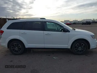 2017 Dodge Journey SE with VIN 3C4PDCAB6HT670624, listed as a IAAI auction lot 41777947 with 143,496 mi miles and . Bid and sale history available at DreamBid. Image 13.
