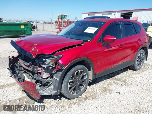 2016 Mazda CX-5 Grand Touring with VIN JM3KE2DYXG0652017, listed as a IAAI auction lot 42041158 with 95,946 mi miles and . Bid and sale history available at DreamBid. Image 17.