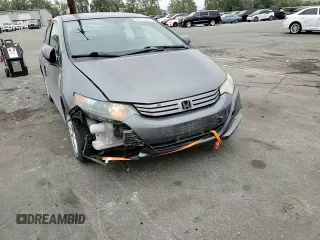 2010 Honda Insight EX with VIN JHMZE2H79AS017647, listed as a Copart auction lot 53311325 with 94,999 mi miles and Salvage Title. Bid and sale history available at DreamBid. Image 10.